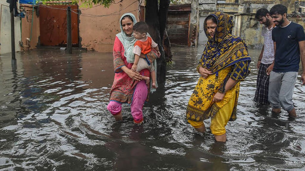 Women and Children during 2025 floods in streets